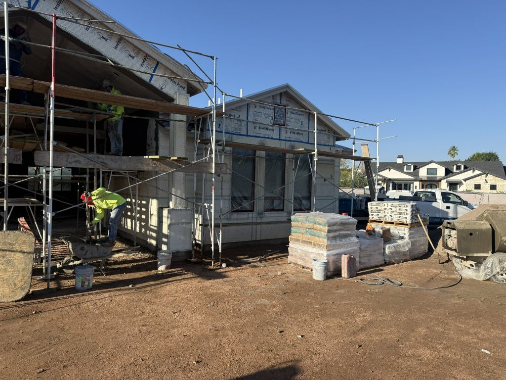 Stucco crew working on scaffolding