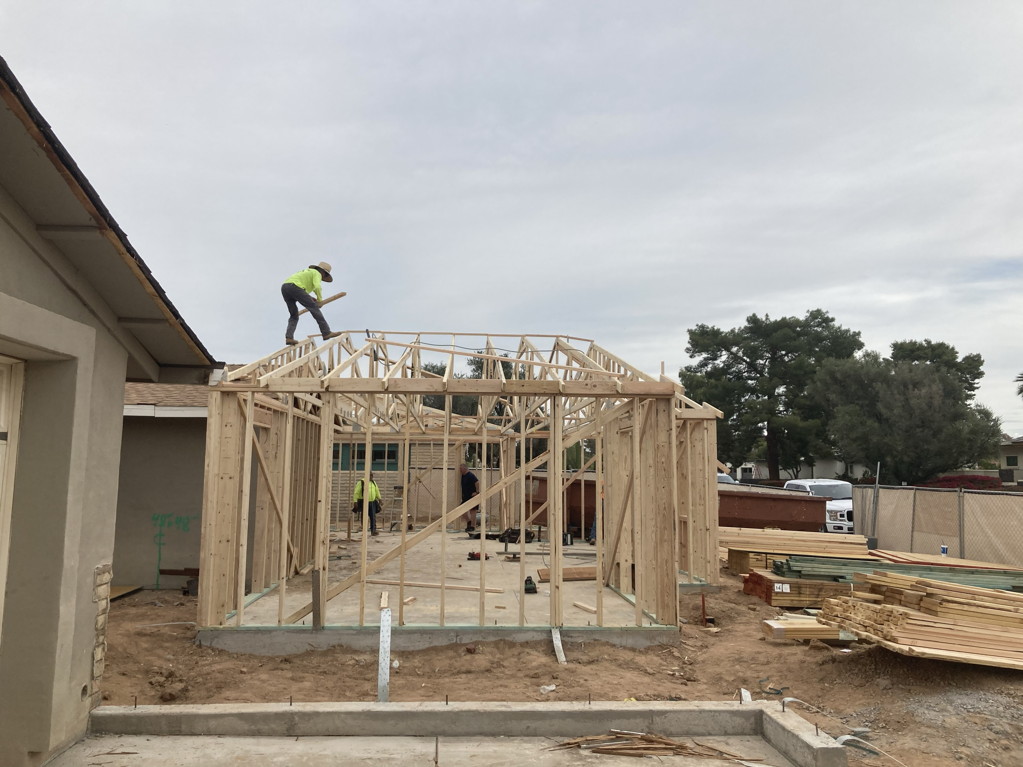 Framing crew building new home addition from the ground up