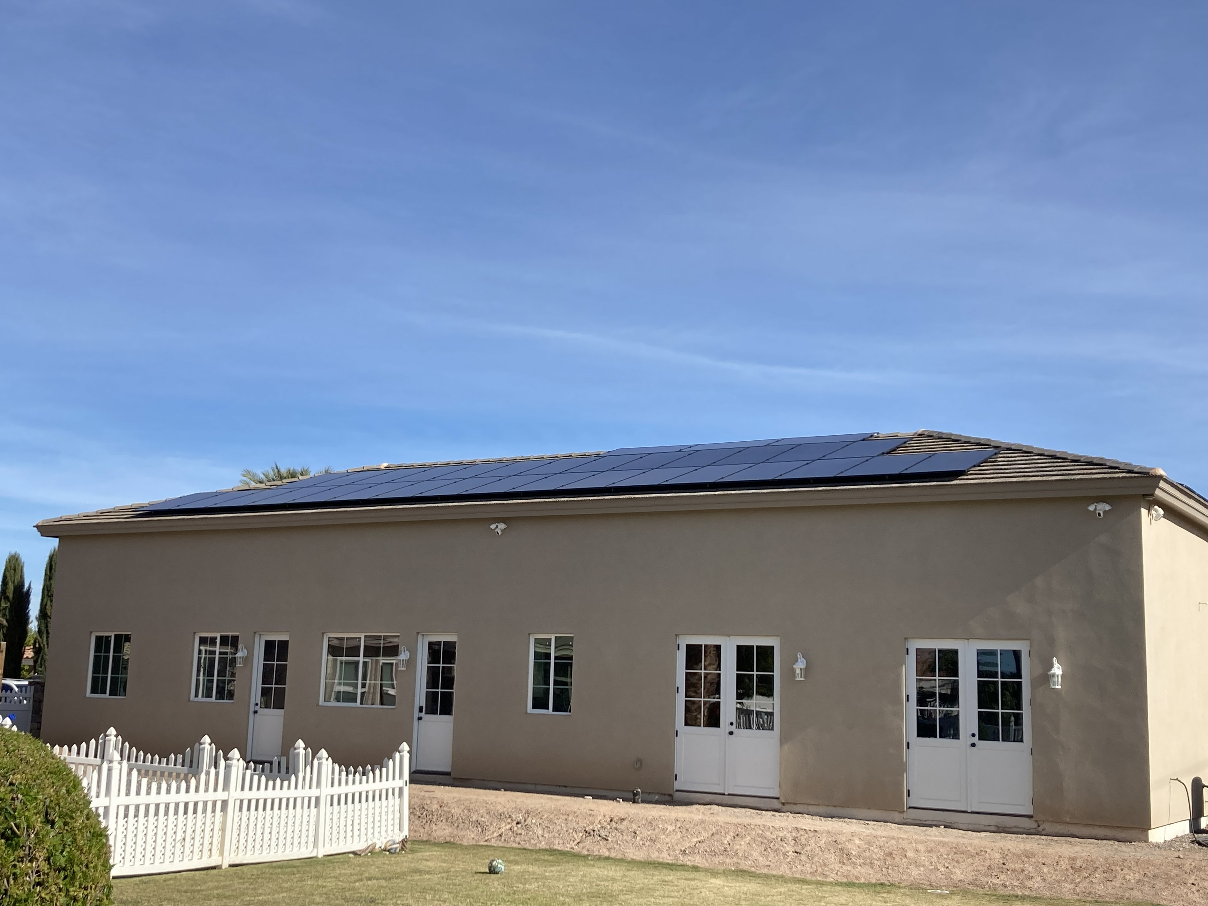 Finished commercial RV garage exterior with stucco and solar panels